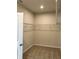 Spacious walk-in closet with wire shelving and carpeted floor at 380 Crossings Ave, St Cloud, FL 34771