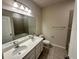 Double vanity bathroom with a large mirror and tiled floors at 500 Crossings Ave, St Cloud, FL 34771