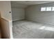 Bright and spacious bonus room with carpeted floors and a large window at 500 Crossings Ave, St Cloud, FL 34771