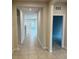 Bright and airy hallway with tile flooring and access to other rooms at 500 Crossings Ave, St Cloud, FL 34771