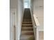 Elegant staircase leads to the upper level of the home at 500 Crossings Ave, St Cloud, FL 34771