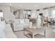Comfortable living room showcases an open floorplan, tile floors, modern decor, and plenty of natural light at 500 Crossings Ave, St Cloud, FL 34771