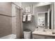Clean bathroom with shower/tub combo, vanity, and neutral tile at 5781 Anders Way, Saint Cloud, FL 34771