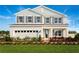 Two-story house with gray siding, shutters, and landscaping at 5781 Anders Way, Saint Cloud, FL 34771
