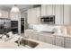Modern kitchen with white cabinets, quartz countertops, and island at 5781 Anders Way, Saint Cloud, FL 34771