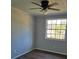 Spacious bedroom with wood-look flooring, ceiling fan and a large window at 5840 Nw 16Th St, Ocala, FL 34482