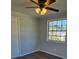 Spacious bedroom with wood-look flooring, ceiling fan and a large window at 5840 Nw 16Th St, Ocala, FL 34482