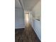 Clean hallway with light gray walls and vinyl flooring at 5840 Nw 16Th St, Ocala, FL 34482