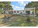 Home with pergola, patio, and landscaped yard at 621 Sw 79Th Ct, Ocala, FL 34474