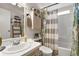 Small bathroom with shower/tub and striped curtain at 621 Sw 79Th Ct, Ocala, FL 34474