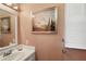 Small bathroom with sink, mirror, and window at 621 Sw 79Th Ct, Ocala, FL 34474