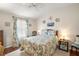 Guest bedroom with coastal decor and ceiling fan at 621 Sw 79Th Ct, Ocala, FL 34474