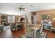 Open concept living and dining area with wood floors at 621 Sw 79Th Ct, Ocala, FL 34474
