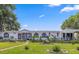 Charming single-story home with a well-manicured lawn and delightful landscaping at 621 Sw 79Th Ct, Ocala, FL 34474