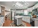 Modern kitchen with white cabinets and stainless steel appliances at 621 Sw 79Th Ct, Ocala, FL 34474