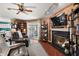 Relaxing living room featuring a fireplace and wood-look wall at 621 Sw 79Th Ct, Ocala, FL 34474