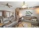 Living room with large sectional sofa and wood floors at 621 Sw 79Th Ct, Ocala, FL 34474
