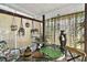 Relaxing sunroom with hanging plants and small table at 621 Sw 79Th Ct, Ocala, FL 34474