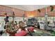 Sunroom with wicker chairs, a desk, and tropical decor at 621 Sw 79Th Ct, Ocala, FL 34474