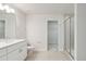Modern bathroom with white vanity, shower, and toilet at 6915 Five Oaks Dr, St Cloud, FL 34773