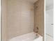 Clean bathroom with a shower/tub combo and tile surround at 6915 Five Oaks Dr, St Cloud, FL 34773