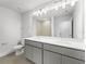 Double vanity bathroom with gray cabinets at 6915 Five Oaks Dr, St Cloud, FL 34773