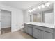 Double vanity bathroom with gray cabinets at 6915 Five Oaks Dr, St Cloud, FL 34773