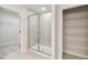Bathroom with a walk-in shower and shelving at 6915 Five Oaks Dr, St Cloud, FL 34773