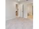 Spacious bedroom with plush carpeting and access to a bathroom and hallway at 6915 Five Oaks Dr, St Cloud, FL 34773