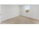 Simple bedroom with neutral walls and carpet at 6915 Five Oaks Dr, St Cloud, FL 34773