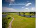 Golf course at Harmony with water features and cart path at 6915 Five Oaks Dr, St Cloud, FL 34773