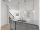 Modern kitchen island with granite countertop and stainless steel appliances at 6915 Five Oaks Dr, St Cloud, FL 34773