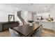 Open concept kitchen with white cabinets, stainless steel appliances, and an island at 6915 Five Oaks Dr, St Cloud, FL 34773