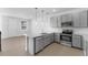 Modern kitchen with gray cabinets, granite countertops and stainless steel appliances at 6915 Five Oaks Dr, St Cloud, FL 34773