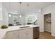 Bright kitchen featuring white cabinets, ample counter space, and a walk-in pantry at 6915 Five Oaks Dr, St Cloud, FL 34773