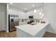 Modern kitchen with white cabinets and stainless steel appliances at 6915 Five Oaks Dr, St Cloud, FL 34773