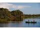 Gathering canoeing on Harmony's serene lake at 6915 Five Oaks Dr, St Cloud, FL 34773