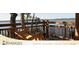 Relaxing lakeside view with wooden swing and scenic overlook at 6915 Five Oaks Dr, St Cloud, FL 34773