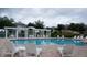 Community pool with lounge chairs and pergola at 6915 Five Oaks Dr, St Cloud, FL 34773