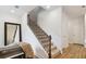 Elegant staircase with iron railing leading to the upper level at 6915 Five Oaks Dr, St Cloud, FL 34773