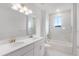 Bathroom boasts double vanity, soaking tub and marble shower at 9432 Emerald Berry Dr, Winter Garden, FL 34787