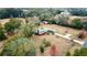 Aerial view of a house on a large property with surrounding trees at 13660 Se 80Th Ave, Summerfield, FL 34491