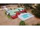 Aerial view showcasing a house with a pool, deck, and spacious backyard at 13660 Se 80Th Ave, Summerfield, FL 34491