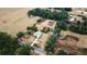 Aerial view of a home with a pool, situated on a large lot at 13660 Se 80Th Ave, Summerfield, FL 34491