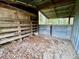 Partially enclosed barn with wooden and metal siding at 13660 Se 80Th Ave, Summerfield, FL 34491