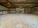 Open-air barn interior with dirt floor and wooden beams at 13660 Se 80Th Ave, Summerfield, FL 34491
