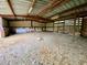 Open-air barn interior with dirt floor and wooden beams at 13660 Se 80Th Ave, Summerfield, FL 34491