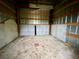 Empty barn interior with dirt floor and metal walls at 13660 Se 80Th Ave, Summerfield, FL 34491