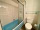 Light blue bath with shower and tub at 13660 Se 80Th Ave, Summerfield, FL 34491
