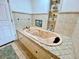 Relax in this large bathroom featuring a luxurious oval jetted tub at 13660 Se 80Th Ave, Summerfield, FL 34491